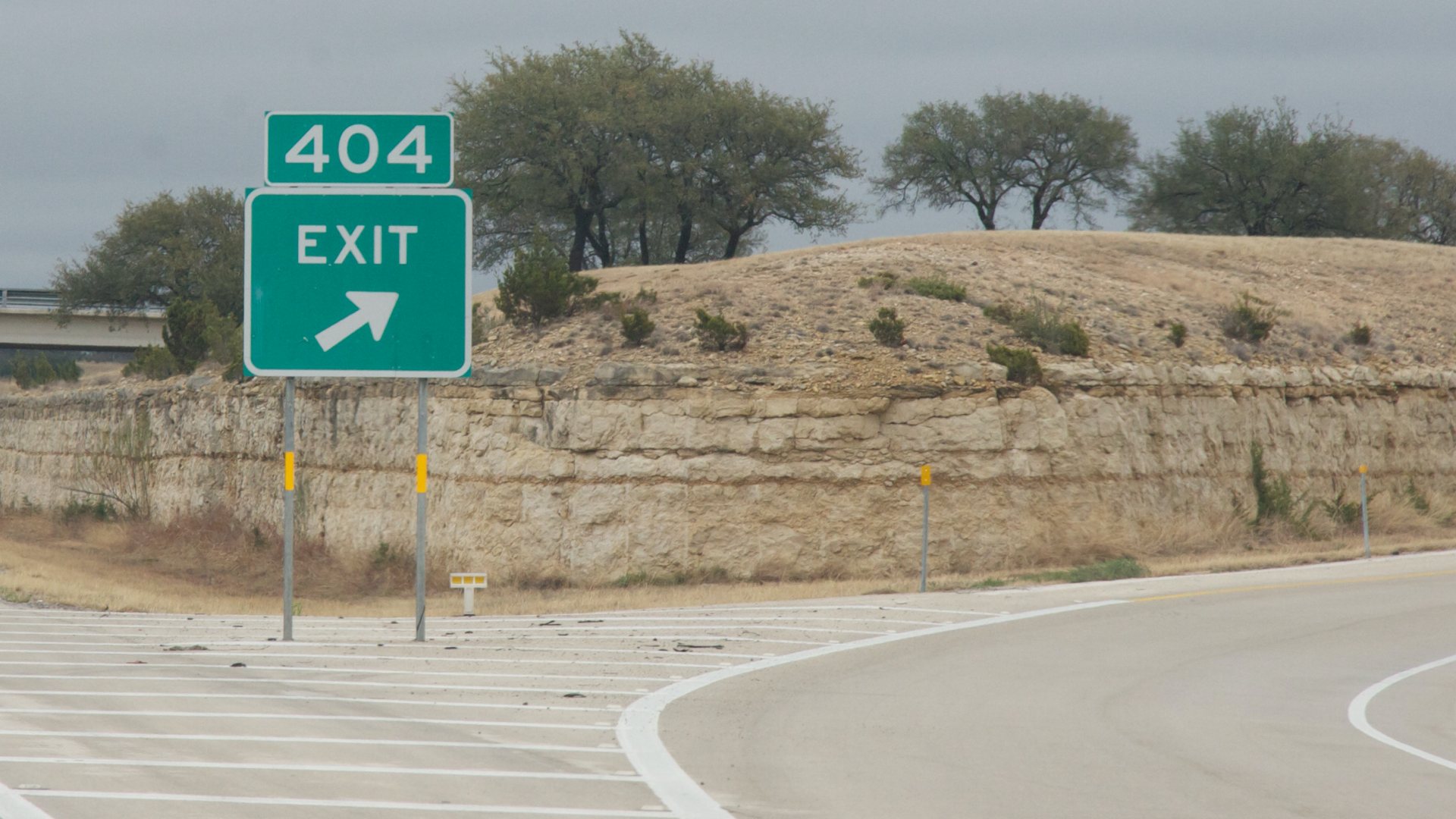 Sign for Exit 404 on an American highway.